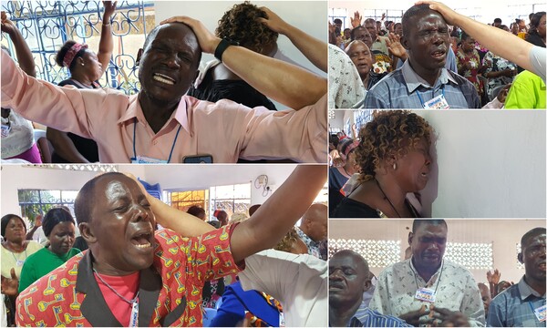 사랑하는교회 선교팀의 안수를 받으며 뜨겁게 눈물로 기도하고 있는 세미나 참석자들. /사랑하는교회